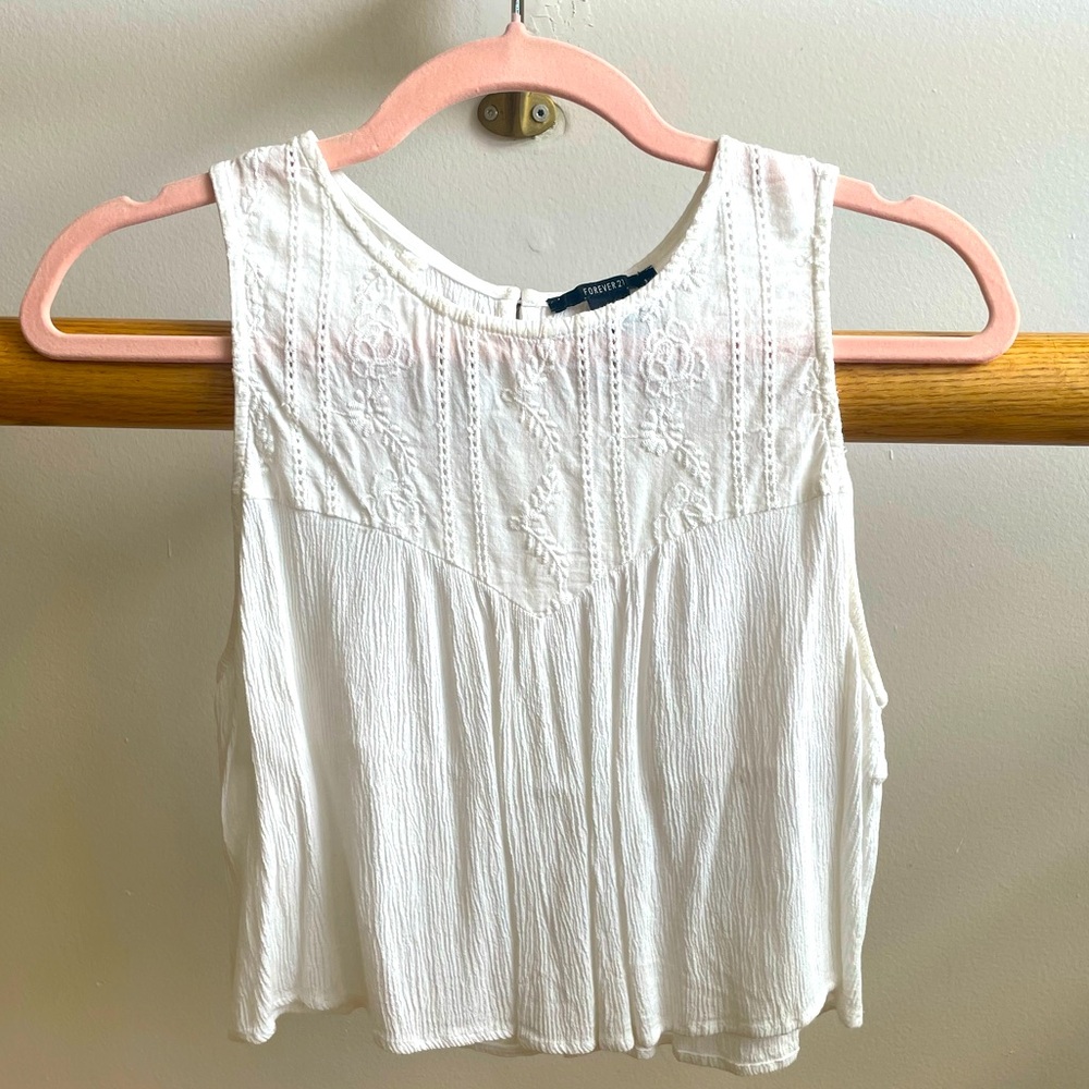 White sleeveless eyelet lace blouse